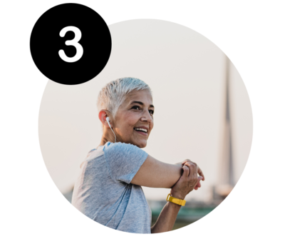 woman with short grey hair stretching her arm